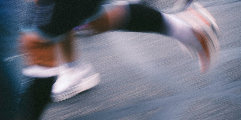 Person running on a road with motion blur effect