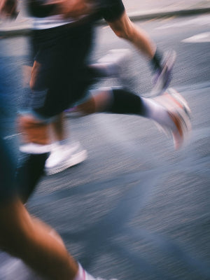 Person running on a road with blurred motion