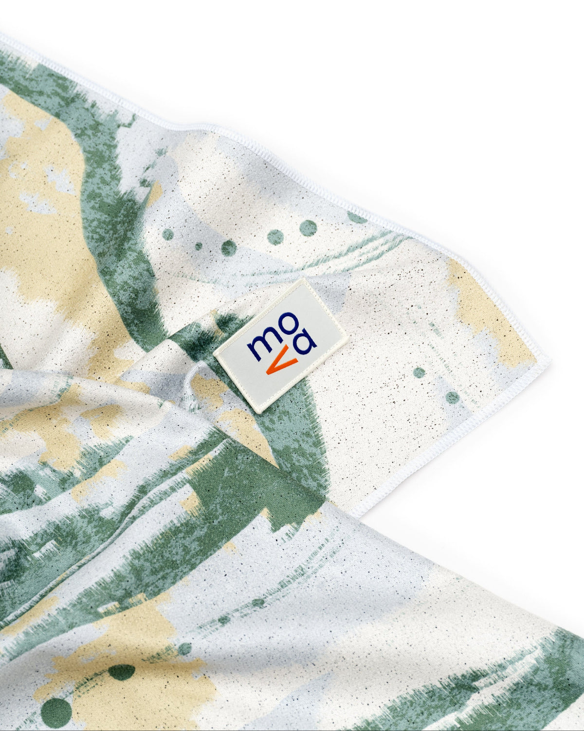 Folded fabric with a pattern and a visible brand label on a white background